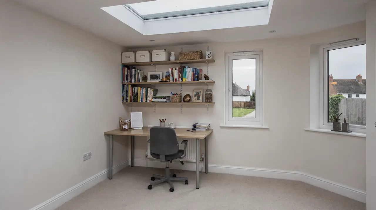 Converted garage room with a flat rooflight in the ceiling