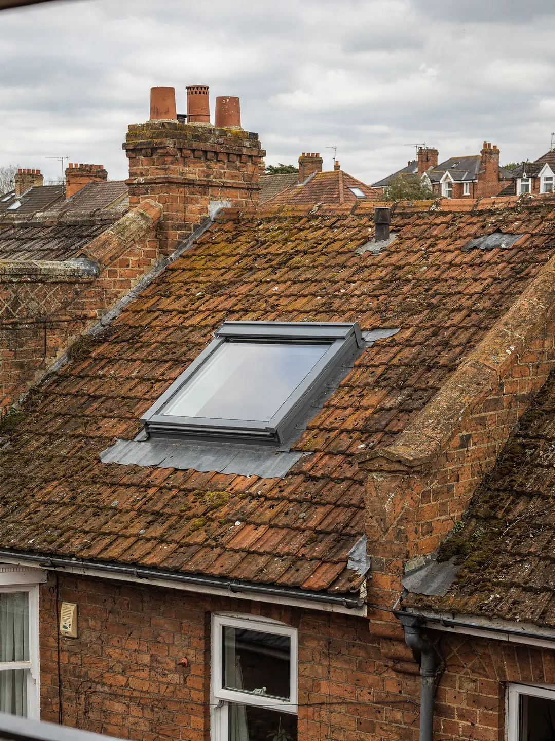 VELUX roof window set into a tiled pitched roof above a loft bedroom