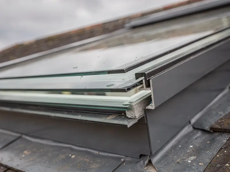 Edge of a triple glazed rooflight unit in its frame