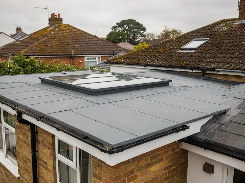 Slim frameless-look flat rooflight on a grey flat roof